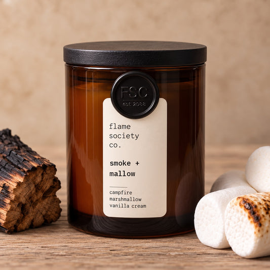Smoke + Mallow 10oz amber jar candle with black wood lid, charred firewood and toasted marshmallows - Flame Society Co.