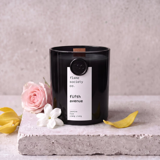 Fifth Avenue candle styled with jasmine, rose and ylang ylang on concrete — Flame Society Co.