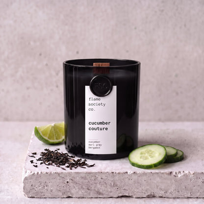 Cucumber Couture candle styled with cucumber, earl grey and bergamot on concrete — Flame Society Co.