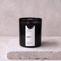 Capri candle hero — black glass vessel with wooden wick, sugared citrus, black currant and mandarin — Flame Society Co.