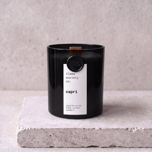 Capri candle hero — black glass vessel with wooden wick, sugared citrus, black currant and mandarin — Flame Society Co.