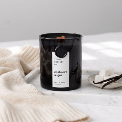 Flame Society Co. Cashmere Sugar candle in black glass vessel with vanilla sugar and cashmere styling.