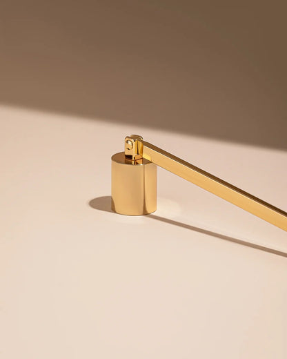 Gold wick snuffer bell cup close-up