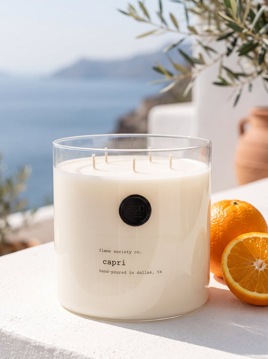 Capri XL 150oz statement candle in a clear glass vessel with wick snuffer — Flame Society Co.