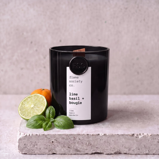 Lime Basil + Bougie candle styled with lime, basil and mandarin on concrete — Flame Society Co.