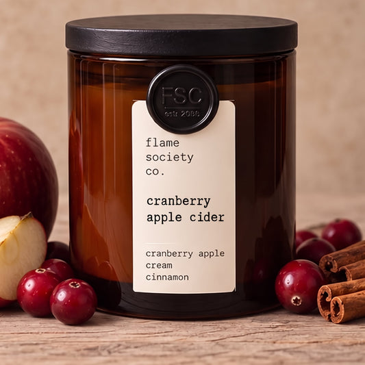 Cranberry Apple Cider 10oz amber jar candle with black wood lid, apples, cranberries and cinnamon - Flame Society Co.