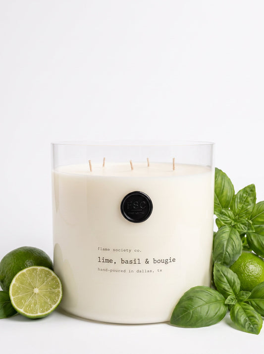 Lime, Basil & Bougie XL 150oz statement candle in a clear glass vessel with wick snuffer — Flame Society Co.