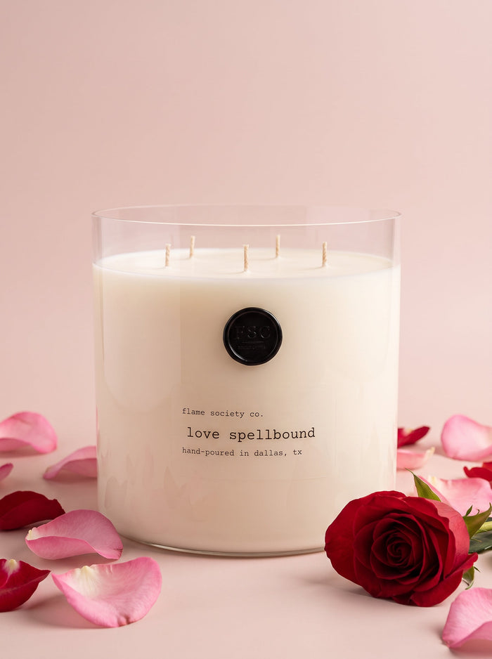 Love Spellbound XL 150oz statement candle in a clear glass vessel with wick snuffer — Flame Society Co.