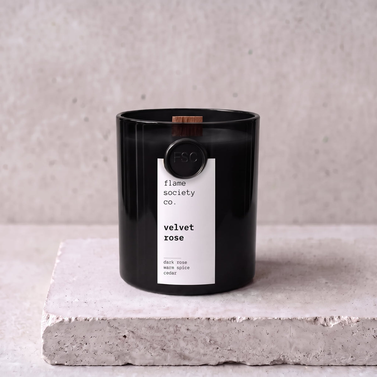 Velvet Rose candle hero — black glass vessel with wooden wick, dark rose, warm spice and cedar — Flame Society Co.