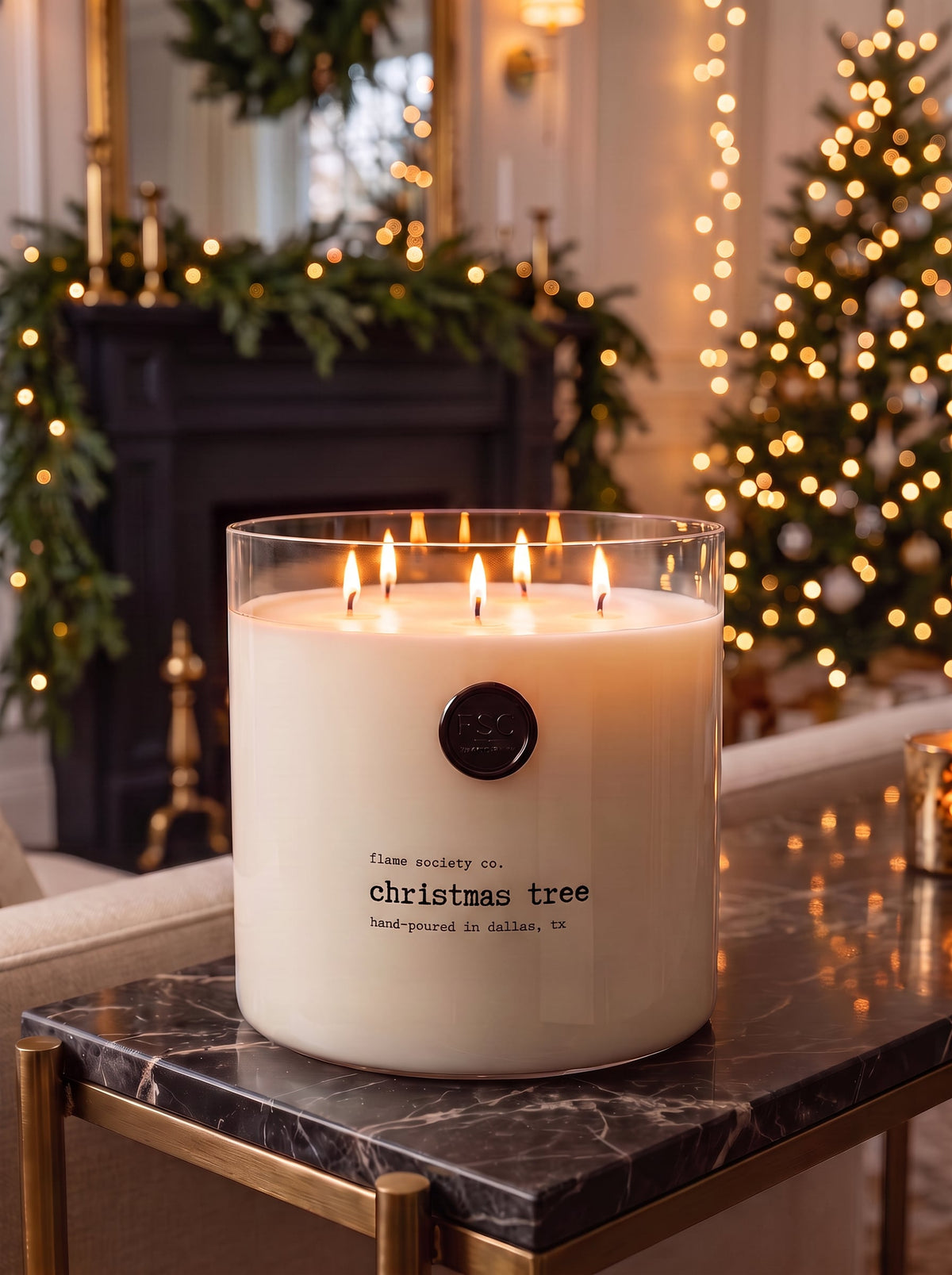 Christmas Tree XL 150oz statement candle in a clear glass vessel in a holiday living room — Flame Society Co.