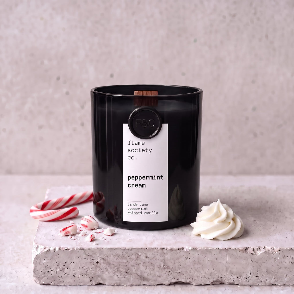 Peppermint Cream candle styled with candy cane, peppermint and whipped cream on concrete — Flame Society Co.