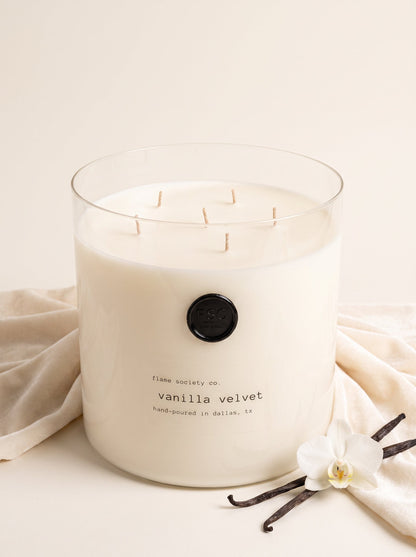 Velvet Vanilla XL 150oz statement candle in a clear glass vessel with wick snuffer — Flame Society Co.